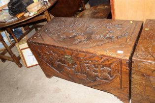 A carved camphorwood storage chest