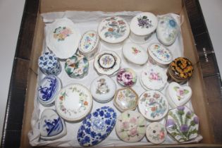 A collection of porcelain trinket boxes including