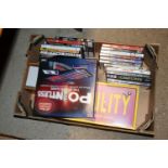 A box containing DVDs and games