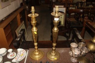 A pair of large brass table lamp bases