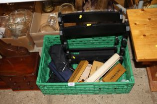 A box containing katana stands and maintenance kit