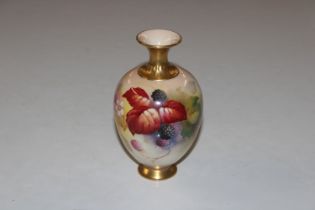 A Royal Worcester vase decorated with flowers and