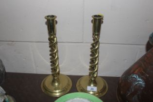 A pair of brass open twist candlesticks