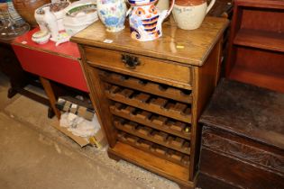 An oak wine rack fitted single drawer