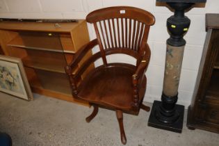An oak swivel office chair baring label, Trevor Pa