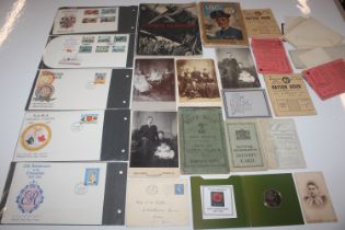 A collection of assorted ephemera, photos, stamps