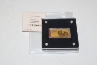 An Orient Express gold proof ingot