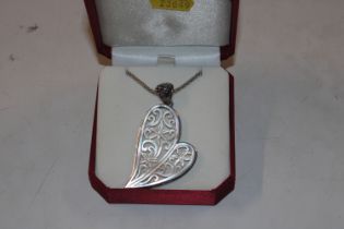 A large Sterling silver and carved mother of pearl