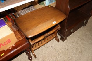 An Ercol side table with integral magazine rack