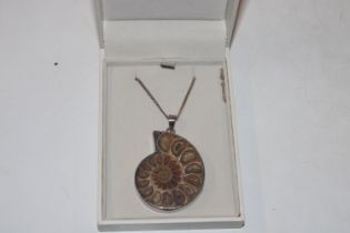 A large Fiorelli Sterling silver and ammonite pend