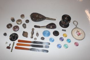 A box containing various silver and other tops, an