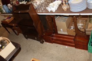 A waterfall bookcase fitted single drawer below to