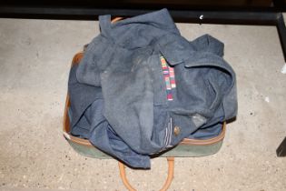 A suitcase containing an RAF dress blouse and trou