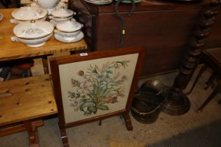 An oak and needlework fire screen together with a