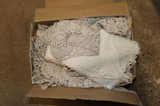 A box of various doilies etc