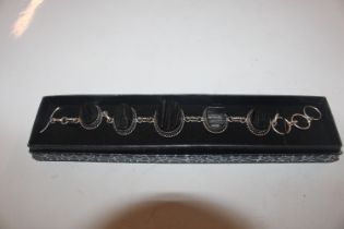 A silver and jet set bracelet