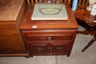 An Oriental hardwood side cupboard fitted single d