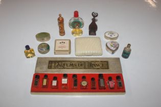 A box containing miniature and other scent bottles