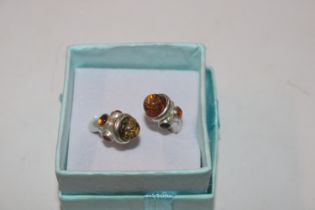 A Hallmarked Sterling silver and amber torque ring