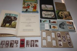 A box of cigarette cards, albums and annuals