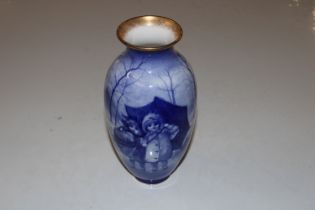 A Royal Doulton blue and white vase decorated with