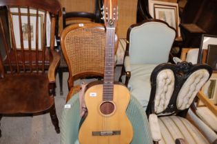 An Italian acoustic guitar with carry bag