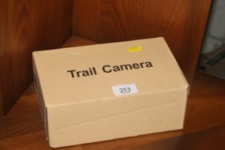 A boxed trail camera