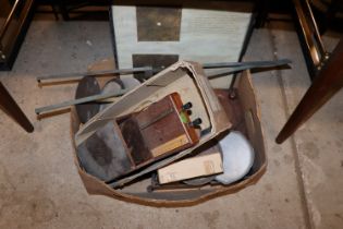 A box containing measurers and sundry items