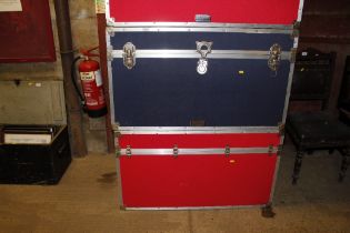 A red flight case and blue flight case