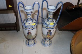 A pair of antique Faience ware twin handled balust