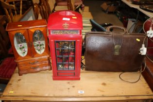 A novelty red telephone box phone, a trinket cabin