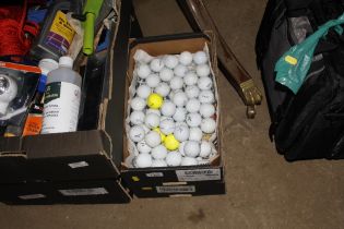 Two boxes of golf balls