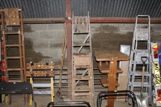 Two wooden folding step ladders