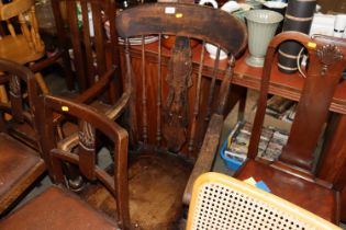 A 19th Century elm slat back elbow chair