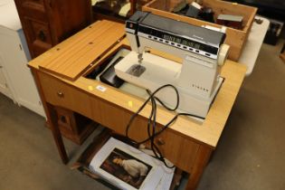 A Futura sewing machine in table case