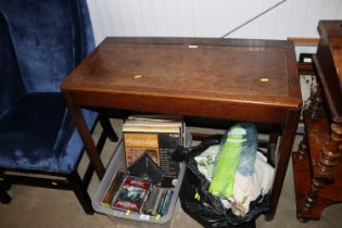 An oak leather topped writing table AF