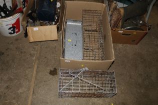 A box of galvanised traps