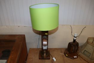 A vintage wooden table lamp, made from a plane