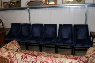 Six blue upholstered chairs