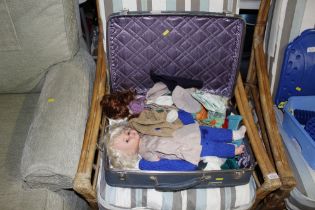 A vintage case and contents of dressed dolls and c