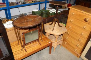 A wicker two tier octagonal topped occasional tabl