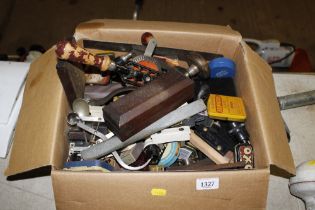 A box of various hand tools including hand drill e