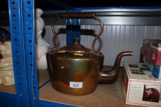 An antique copper kettle