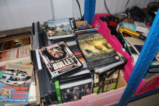 A box of miscellaneous DVDs