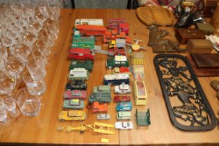A collection of various die cast vehicles. some Co