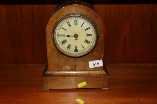 A Victorian walnut mantel timepiece