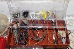 A fishing box and contents of various tackle and r