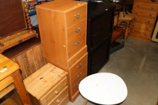 A pair of pine effect three drawer bedside chests,