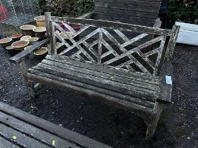 A hardwood slatted garden bench