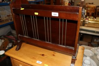 A mahogany magazine rack